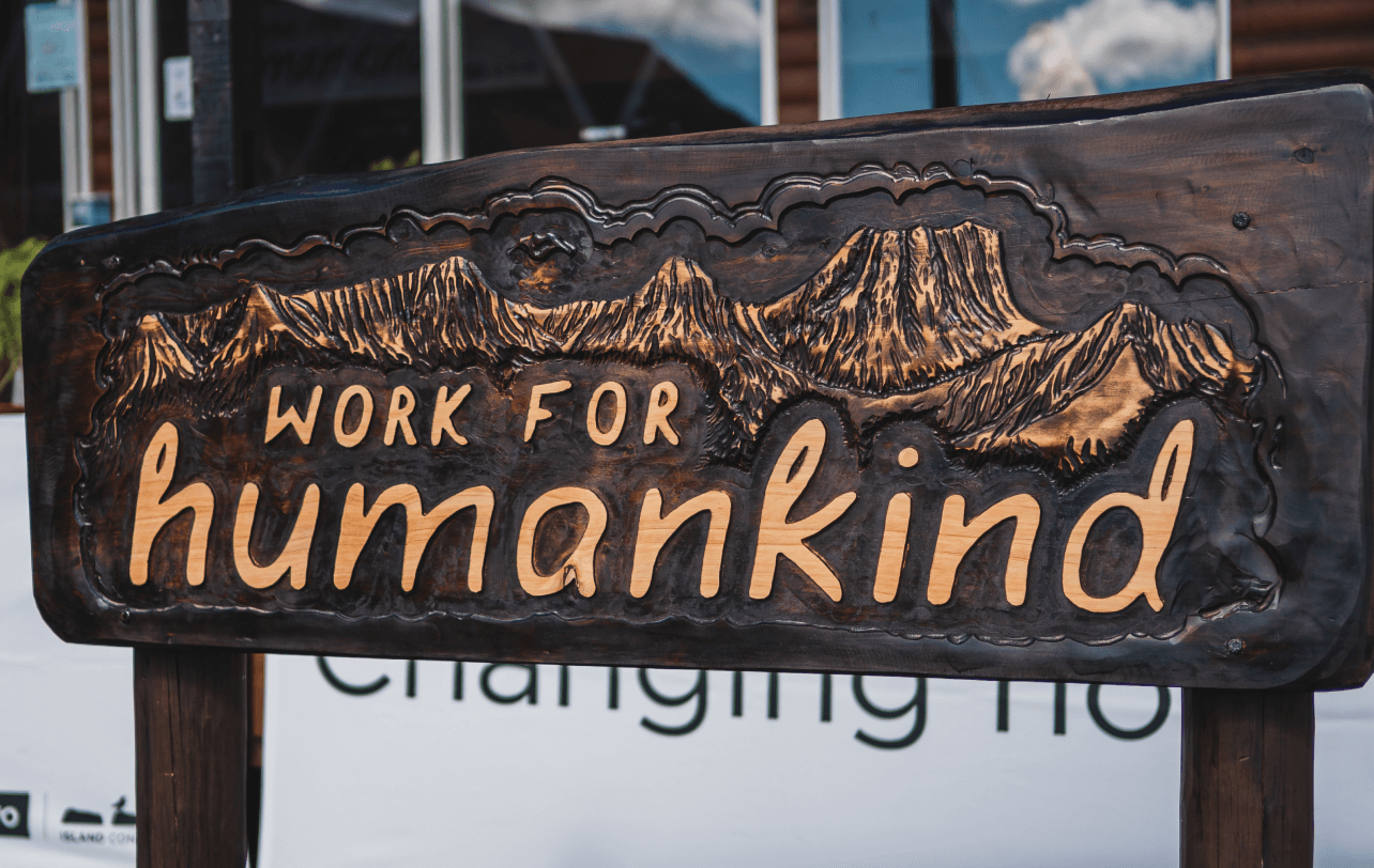 Working for jumankind sign